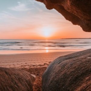 Wandbild Sonnenuntergang an den Klippen